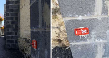 Surveyor brengt Rothbucher RS30 rood aan op betonmuur