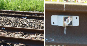 Mini prisma RSMP15 gemonteerd op een spoorstaaf voor zettingsmeting onder treinbelasting