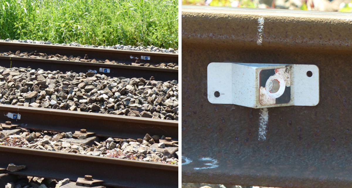 Mini prisma RSMP15 gemonteerd op een spoorstaaf voor zettingsmeting onder treinbelasting